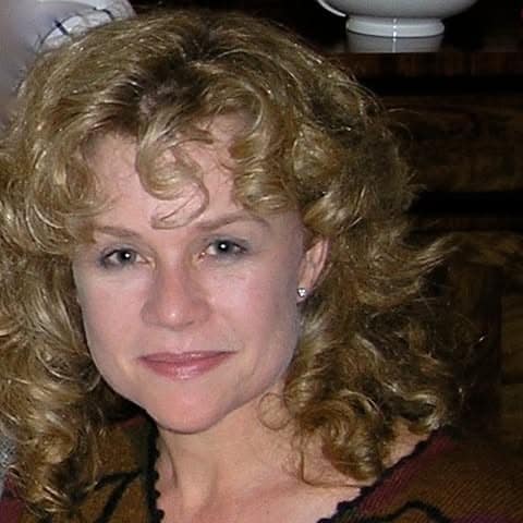 Karen Hackett smiling at the camera.
